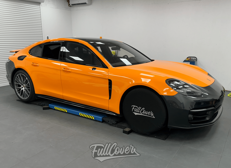 Covering total orange éclatant sur Porsche Panamera : transformation audacieuse et stylée à Orléans